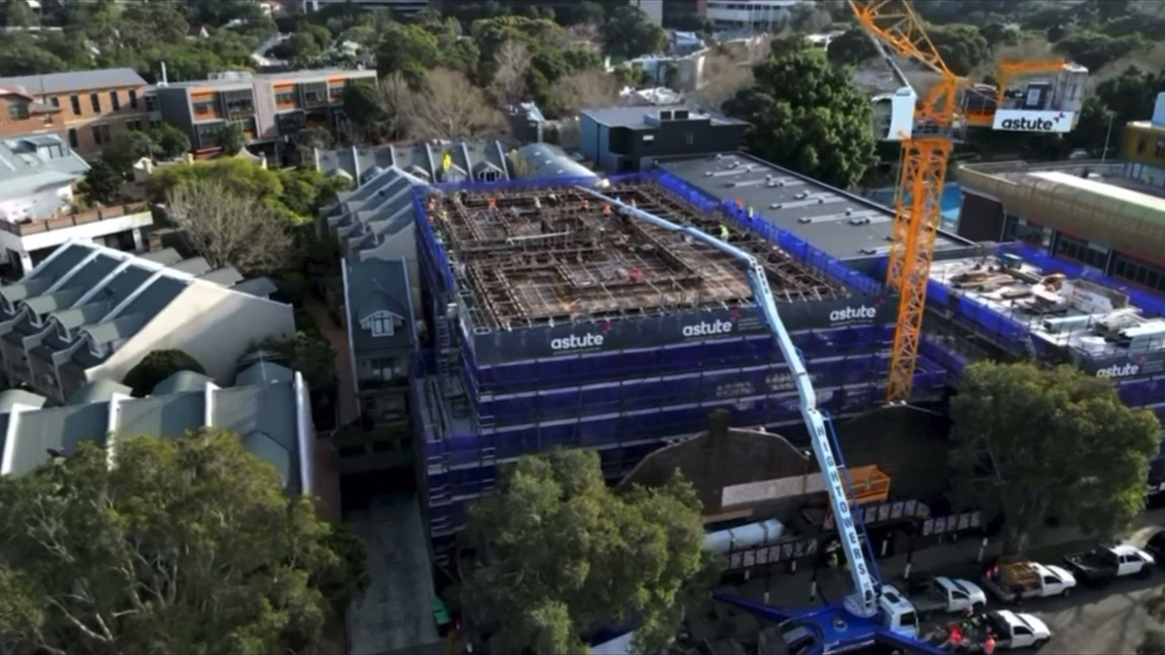 Aerial view over the top slab of the Alexandria project with scaffold on every face