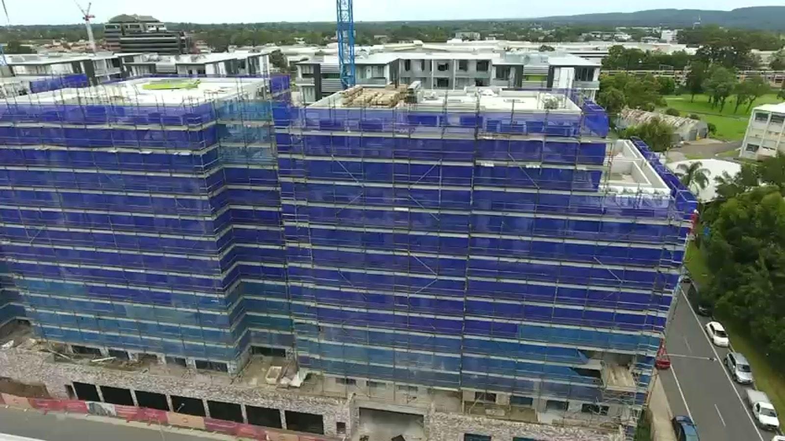 Aerial view of the Navali development at Thornton, Penrith, both buildings fully wrapped in Ozscaf scaffold