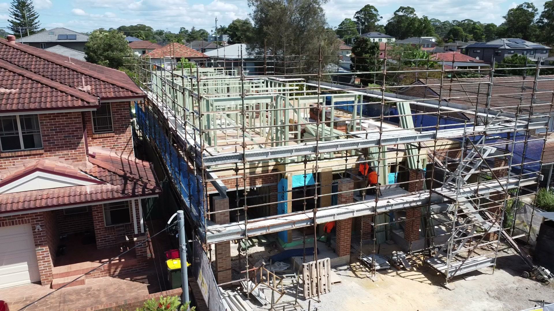 Perimeter scaffold on a two-storey duplex build, seen from above